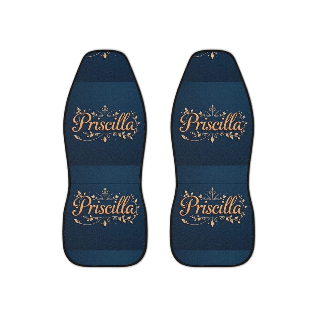 Two blue car seat covers with elegant script text designs.
