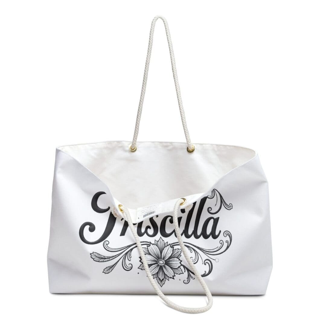 White tote bag with floral design and cursive text.