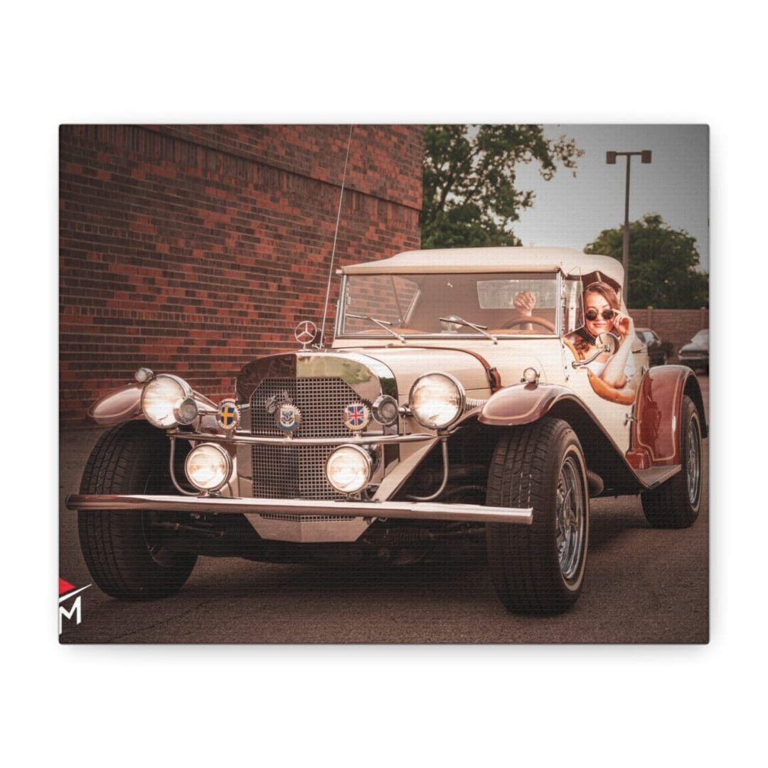 A vintage car with a couple dressed in formal attire.